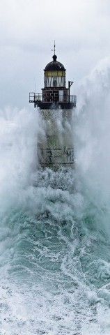 Photo Ar Men lighthouse under the waves, Brittany par Philip Plisson