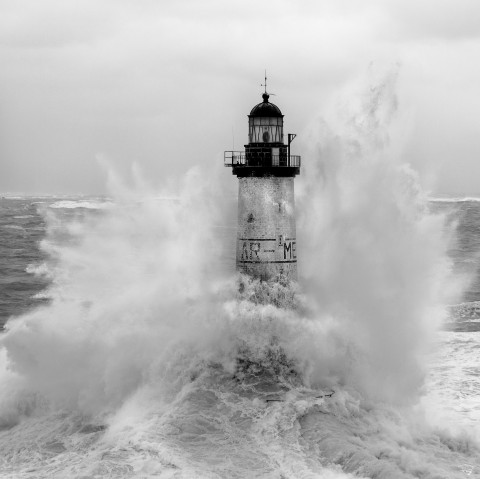 Photo Ar Men lighthouse in the middle of a storm, Brittany par Philip Plisson